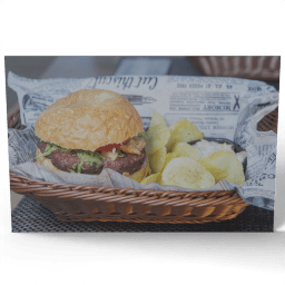 Delicious Burger and Fries in a Basket undated